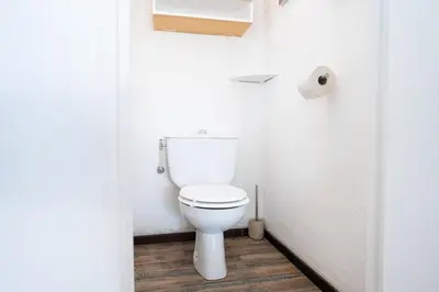 a bathroom with a toilet and a roll of toilet paper at Charmant 2 Pièces au Cannet in Le Cannet