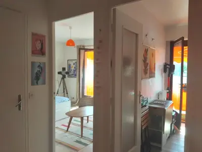 a room with a door leading to a bedroom at Beau studio à 5 min de la plage in Cannes