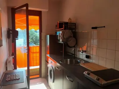 a kitchen with a sink and a counter top at Beau studio à 5 min de la plage in Cannes