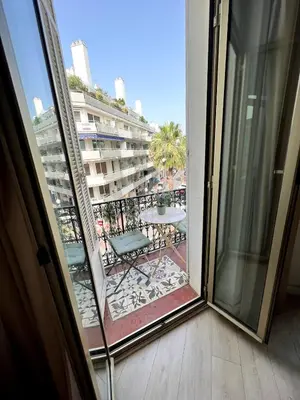 a balcony with a view of a building at T2 coeur de Cannes a 2 pas de la croisette in Cannes