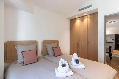 a bedroom with two towels on a bed at Apartment 2 bedrooms near beach - Cannes in Cannes