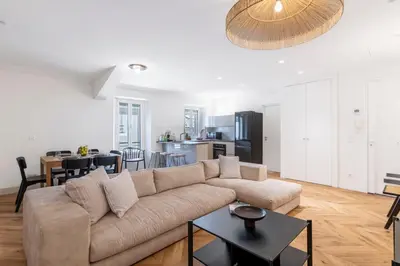 a living room with a couch and a table at Apartment 2 bedrooms near beach - Cannes in Cannes