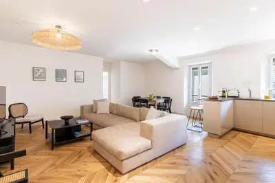 a living room with a couch and a table at Apartment 2 bedrooms near beach - Cannes in Cannes