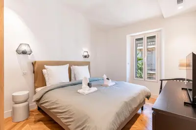 a bedroom with a bed with two stuffed animals on it at Apartment 2 bedrooms near beach - Cannes in Cannes