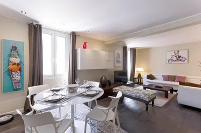 a living room with a white table and chairs at Notre Dame - Terrace, AC, 3mn from Palais & Beach, modern in Cannes
