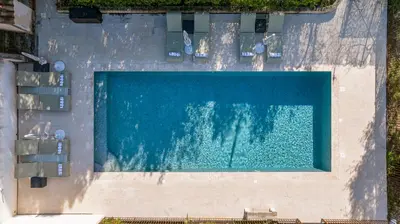 an overhead view of a swimming pool in a resort at Villa Lou San Peyre, Cannes et Mougins, 4 km des plages in Le Cannet