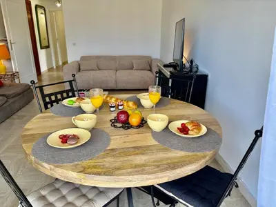 a wooden table with fruit on it in a living room at Eden Park in Cannes