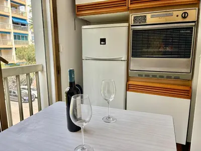 a table with two wine glasses and a bottle of wine at Eden Park in Cannes