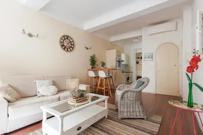 a living room with a couch and a table at Immogroom - T2 - 10 min walk from Palais in Cannes