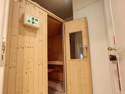 a room with a door open to a room with a room at FRGK OXFORD palace park in Cannes