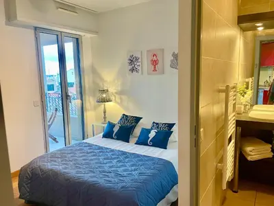 a bathroom with a tub and a sink and a shower at Harbor Dockside in Cannes