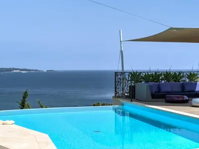 a swimming pool with a view of the ocean at Immogroom - Amazing Villa with sea view in Vallauris