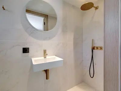 a white bathroom with a sink and a mirror at Immogroom - Amazing Villa with sea view in Vallauris