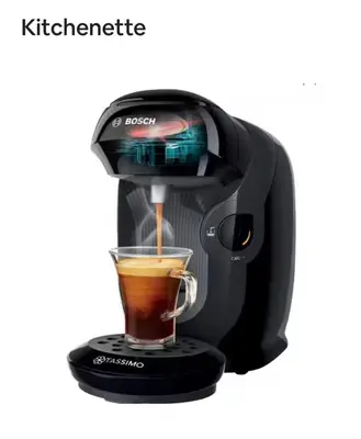 a black coffee maker with a cup of coffee at Calmette in Cannes