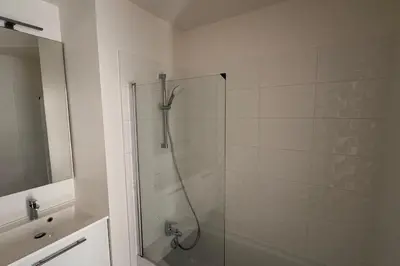 a shower with a glass door in a bathroom at Charming 3 rooms located in Le Cannet near Cannes in Le Cannet