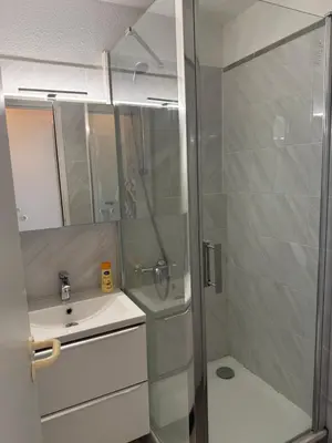 a bathroom with a shower and a sink at Pierre Vacances VUE MER 748 in Cannes