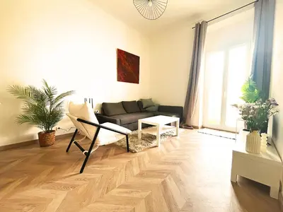 a living room with a couch and a table at Cannes Banane in Cannes