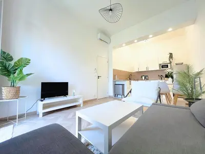 a living room with a couch and a table at Cannes Banane in Cannes
