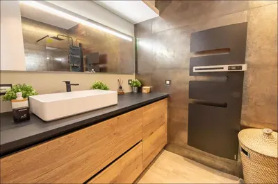a bathroom with a white sink and a mirror at LE COCON DE JAURÈS entre Gare Croisette et Palais in Cannes