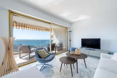 a living room with a view of the ocean at 2-Br Apartment Sea View & Pool Cannes Croix des Gardes in Cannes
