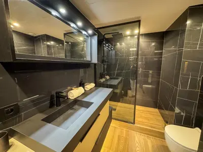 a bedroom with a large bed with white sheets and pillows at LUXURY EQUINOX 3 Bedrooms in Cannes