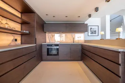 a kitchen with wooden cabinets and a sink at REF 2176 - Cannes -Villa panoramic sea view in Cannes