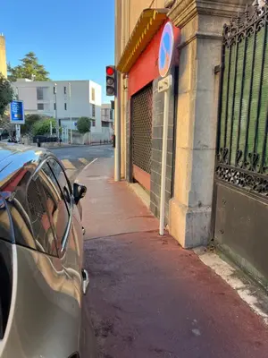 a car parked on a street next to a building at Apparemment151 in Cannes