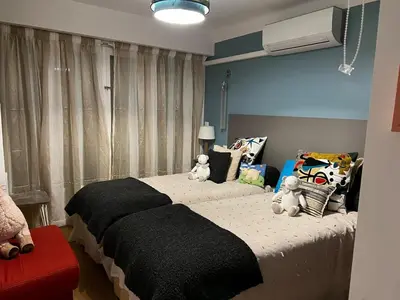 a bedroom with a bed with two teddy bears on it at Beautiful renovated luxury apartment terrace parking in Cannes