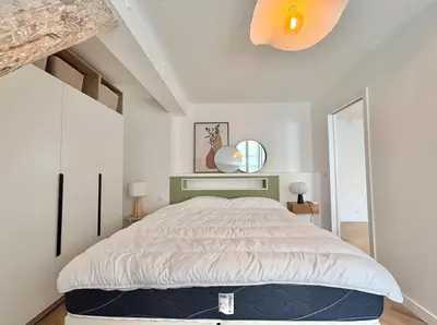 a bedroom with a large bed in a room at Cannes 1 bedroom apartment - FC8 in Cannes