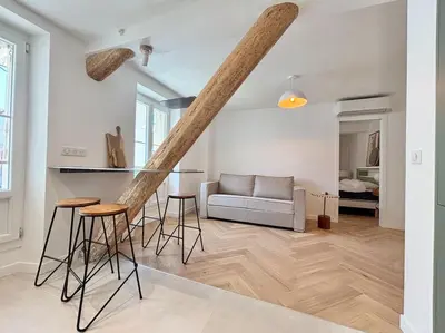 a living room with a couch and a table at Cannes 1 bedroom apartment - FC8 in Cannes