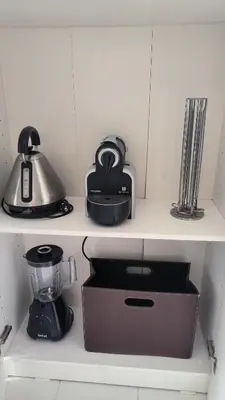 a kitchen shelf with a blender and a tea pot at Palm d'Azur 459 in Cannes