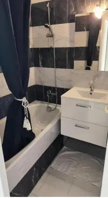 a bathroom with a sink and a tub and a shower at Palm d'Azur 459 in Cannes