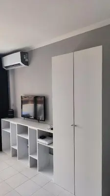 a room with a white desk with a television on it at Palm d'Azur 459 in Cannes