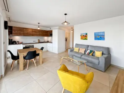 a living room with a couch and a table at CAM103 - Beau 2 pièces avec terrasse in Cannes