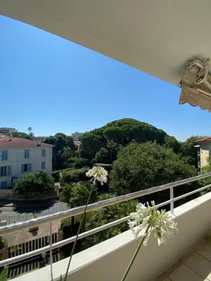 a balcony with a view of a city at Prince de Galles in Cannes
