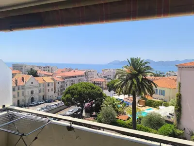 a view of a city from a balcony at 3-room air-conditioned terrace, sea view in Cannes