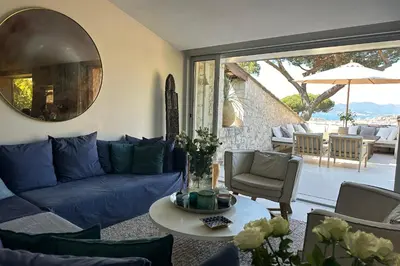 a living room with a blue couch and a table at Cannes - Villa for rent - 2179 in Cannes