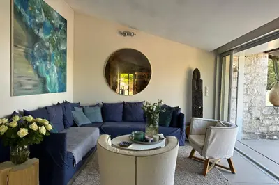 a living room with a blue couch and a table at Cannes - Villa for rent - 2179 in Cannes