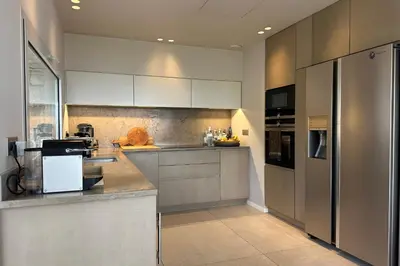 a kitchen with white cabinets and a counter top at Cannes - Villa for rent - 2179 in Cannes