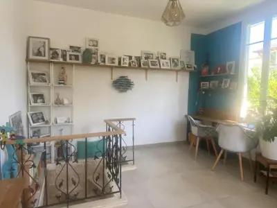 a living room with a table and a desk at Villa piscine cannes 2 chambres in Cannes