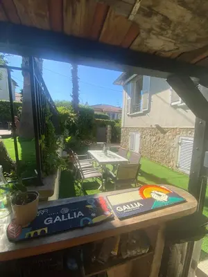 a view from a window of a patio with a table at Villa piscine cannes 2 chambres in Cannes