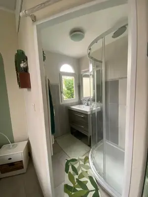 a bathroom with a shower and a sink at Villa piscine cannes 2 chambres in Cannes