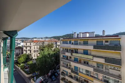 a view from the balcony of a building at LB Vacation Rentals I Elegant Apartment with Terrace & Mezzanine in the heart of Cannes in Cannes