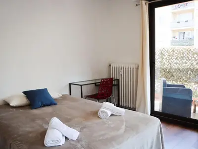 a bedroom with a bed with two towels on it at Apartment les Gemeaux by Interhome in Le Cannet