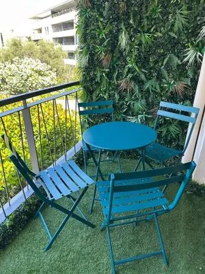 two chairs and a table on a balcony at Bali à Cannes in Cannes