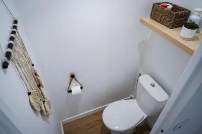 a bathroom with a white toilet in a room at Bali à Cannes in Cannes