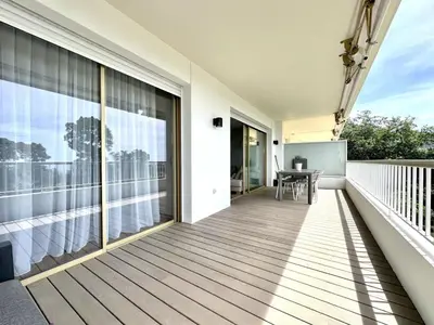a balcony with a view of the water at appartement cannes in Cannes