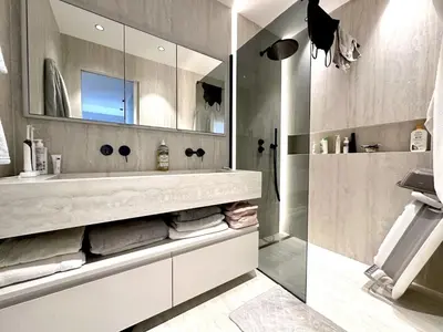 a bathroom with a sink and a mirror at appartement cannes in Cannes