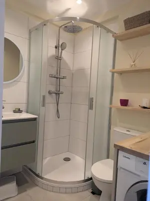a shower in a bathroom with a toilet and a sink at Charming 2-room apartment in Cannes in Cannes