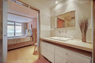 a bathroom with a sink and a mirror at REF 1434 - Cannes Croisette - Sea view apartment for rent in Cannes